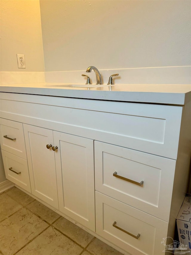 bathroom featuring tile patterned floors and vanity