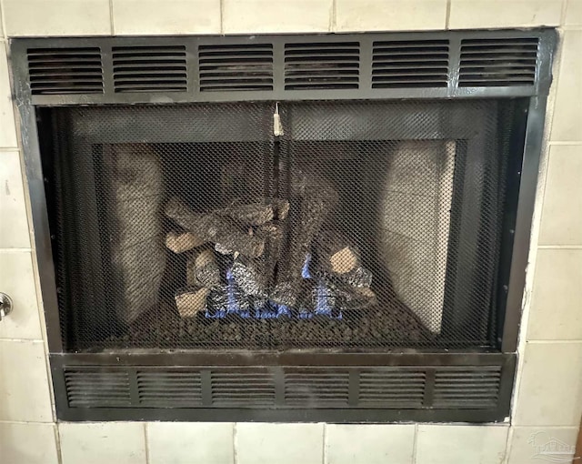 interior details featuring a fireplace and cooling unit