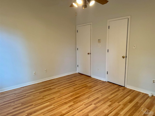 unfurnished bedroom featuring ceiling fan and light hardwood / wood-style floors