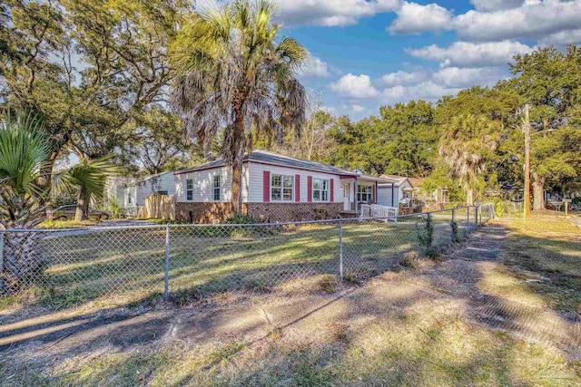 ranch-style home with a front lawn