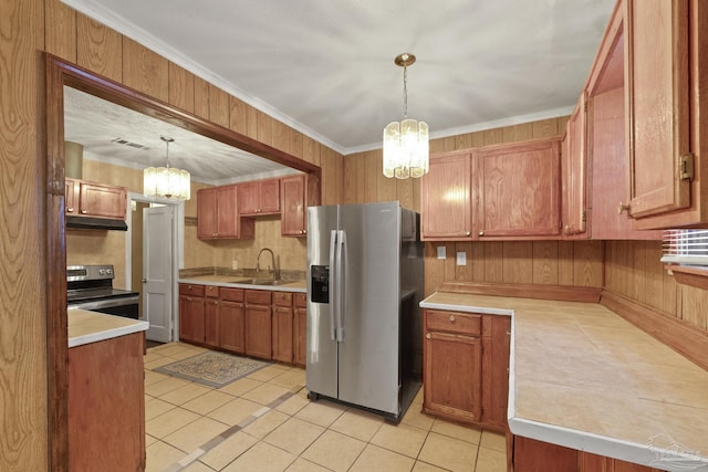 kitchen featuring light tile patterned flooring, sink, an inviting chandelier, appliances with stainless steel finishes, and pendant lighting