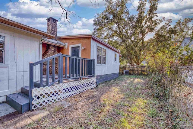 view of side of property with central AC