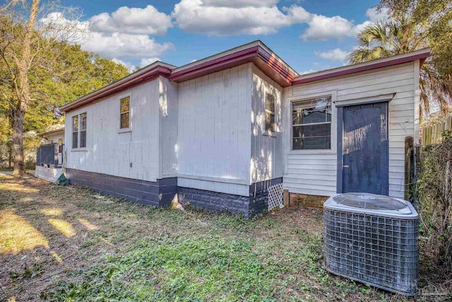 view of home's exterior with central AC