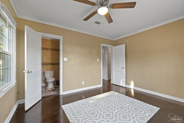 bedroom featuring ensuite bath, ornamental molding, dark hardwood / wood-style floors, and ceiling fan