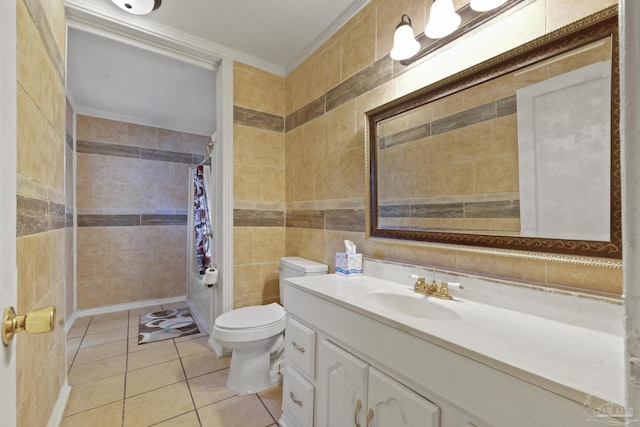 bathroom featuring tile walls, vanity, toilet, crown molding, and tile patterned floors