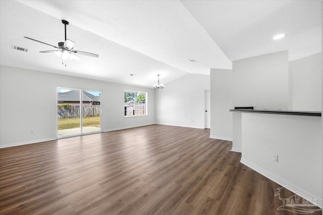 6914 Raburn Rd, Pensacola, FL 32526 - unfurnished living room featuring baseboards, lofted ceiling, dark wood finished floors, and visible vents