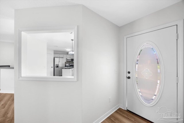 6914 Raburn Rd, Pensacola, FL 32526 - entryway with baseboards, a wealth of natural light, and wood finished floors