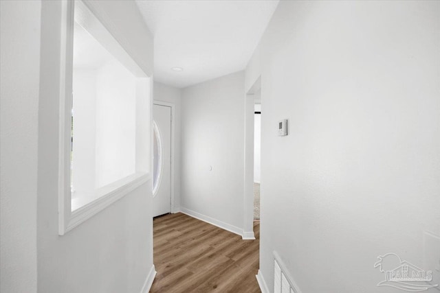 6914 Raburn Rd, Pensacola, FL 32526 - hallway with baseboards, wood finished floors, and visible vents