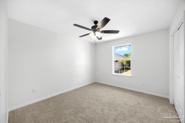 6914 Raburn Rd, Pensacola, FL 32526 - unfurnished bedroom featuring baseboards, a ceiling fan, a closet, and carpet flooring