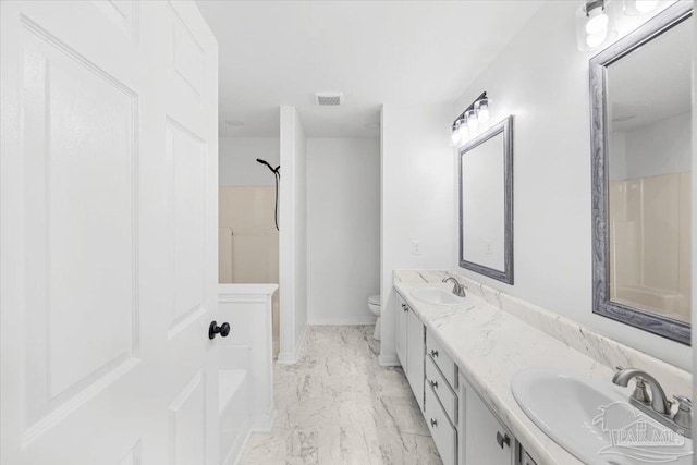 6914 Raburn Rd, Pensacola, FL 32526 - bathroom with double vanity, toilet, a sink, and marble finish floor