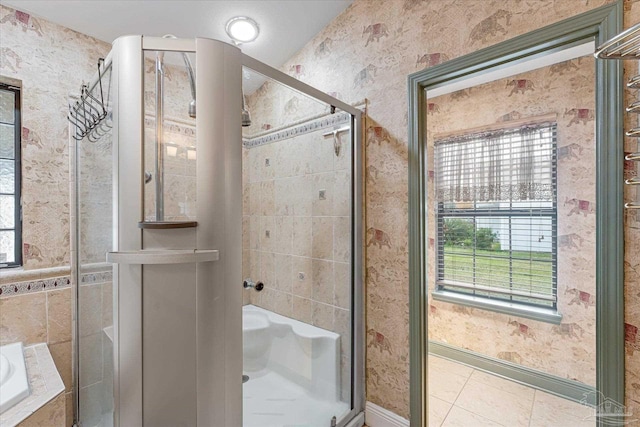 bathroom featuring plus walk in shower, tile patterned flooring, and plenty of natural light