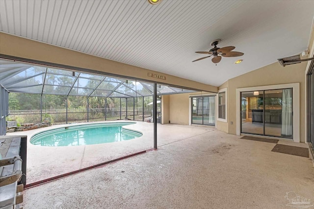 view of swimming pool featuring a lanai, a patio area, and ceiling fan