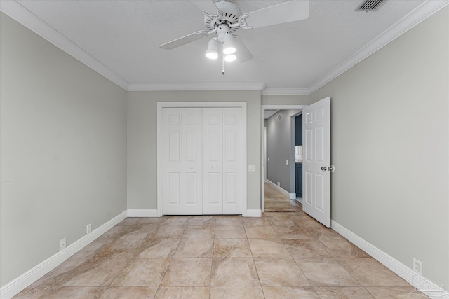 unfurnished bedroom with ceiling fan, crown molding, a textured ceiling, a closet, and light tile patterned floors