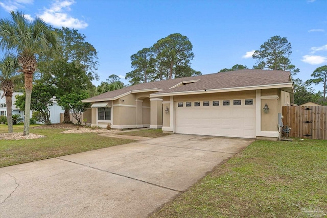 view of front of house featuring a front yard and a garage