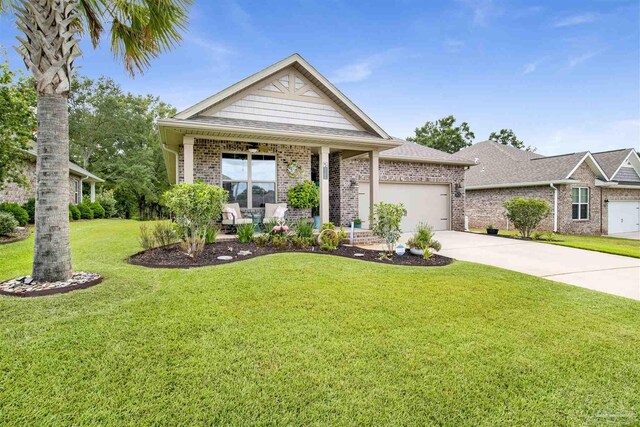 view of front of property with a garage and a front yard