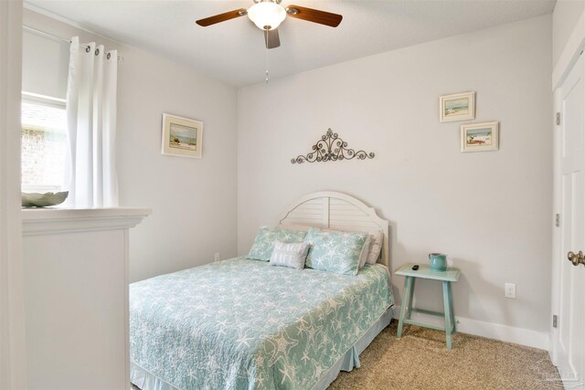 bedroom with light carpet and ceiling fan