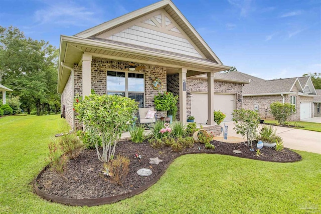 view of front of property featuring brick siding, concrete driveway, ceiling fan, a garage, and a front lawn