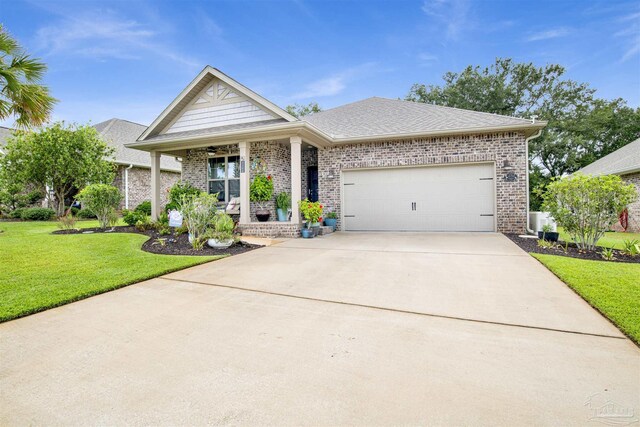 view of front of house with a garage and a front lawn