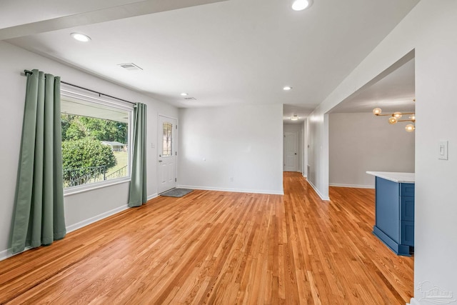 7332 Maxam Ave, Pensacola, FL 32503 - unfurnished living room featuring light hardwood / wood-style flooring