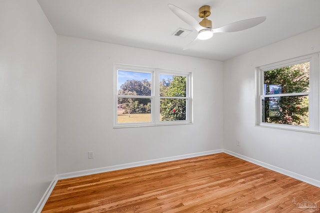 7332 Maxam Ave, Pensacola, FL 32503 - spare room with ceiling fan, light hardwood / wood-style flooring, and a healthy amount of sunlight