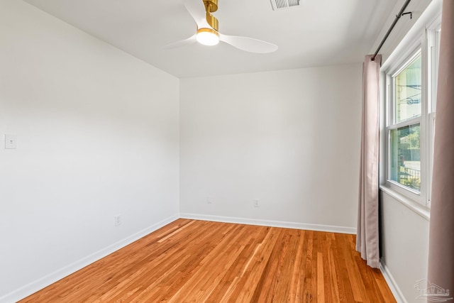 7332 Maxam Ave, Pensacola, FL 32503 - unfurnished room with a wealth of natural light, light hardwood / wood-style flooring, and ceiling fan