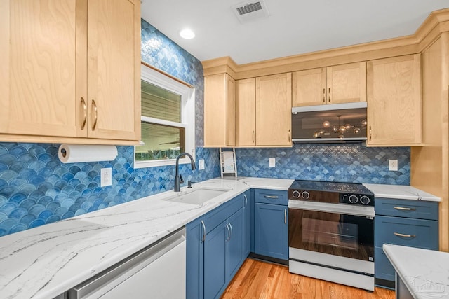 7332 Maxam Ave, Pensacola, FL 32503 - kitchen featuring appliances with stainless steel finishes, light stone counters, sink, light brown cabinets, and light hardwood / wood-style floors