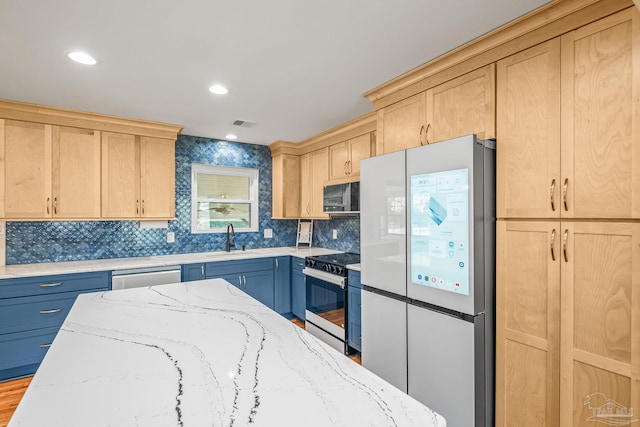 7332 Maxam Ave, Pensacola, FL 32503 - kitchen with light stone countertops, stainless steel appliances, light hardwood / wood-style floors, and sink