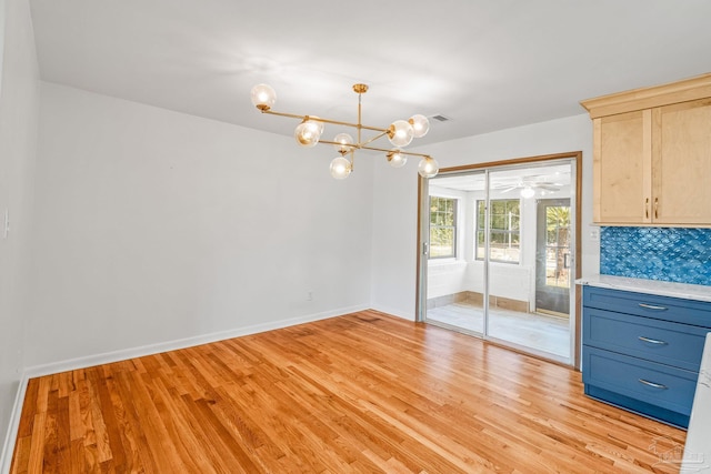 7332 Maxam Ave, Pensacola, FL 32503 - unfurnished dining area with an inviting chandelier and light hardwood / wood-style flooring