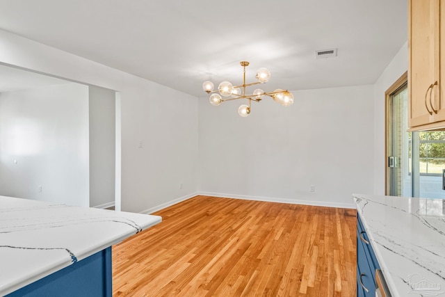 7332 Maxam Ave, Pensacola, FL 32503 - dining room featuring a notable chandelier and light hardwood / wood-style flooring