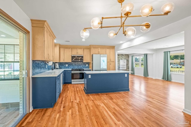 7332 Maxam Ave, Pensacola, FL 32503 - kitchen featuring appliances with stainless steel finishes, light wood-type flooring, pendant lighting, and light brown cabinets