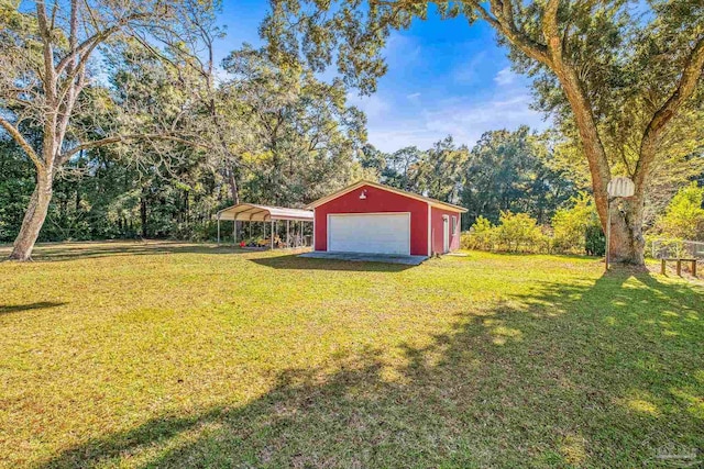 7332 Maxam Ave, Pensacola, FL 32503 - view of yard featuring a carport, a garage, and an outdoor structure