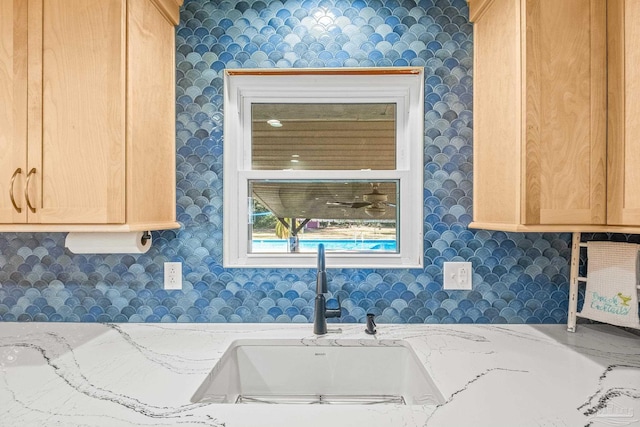 7332 Maxam Ave, Pensacola, FL 32503 - room details featuring light brown cabinets, light stone countertops, and sink