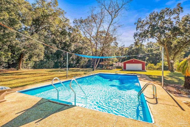 7332 Maxam Ave, Pensacola, FL 32503 - view of pool featuring an outbuilding, a garage, and a lawn