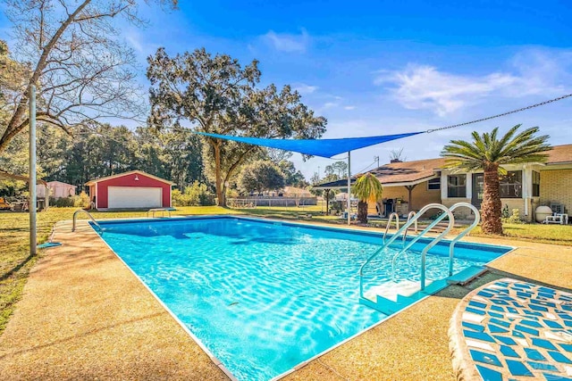 7332 Maxam Ave, Pensacola, FL 32503 - view of pool featuring an outbuilding, a yard, and a garage