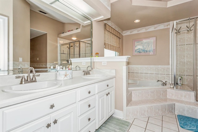 bathroom featuring tile patterned flooring, vanity, and independent shower and bath