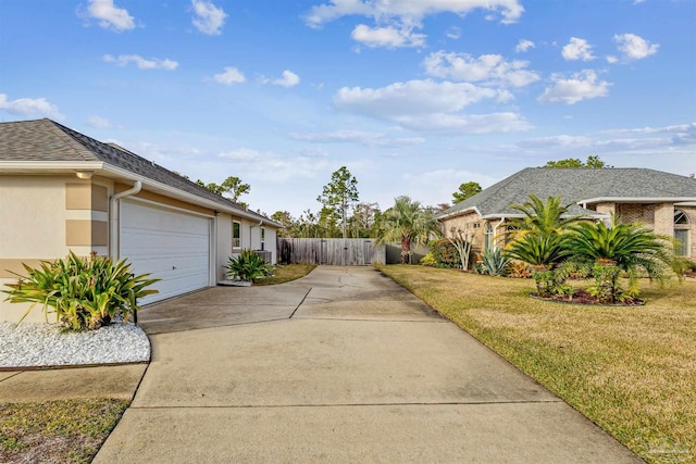 view of home's exterior featuring a yard and a garage