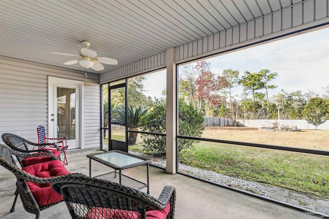 sunroom / solarium with ceiling fan