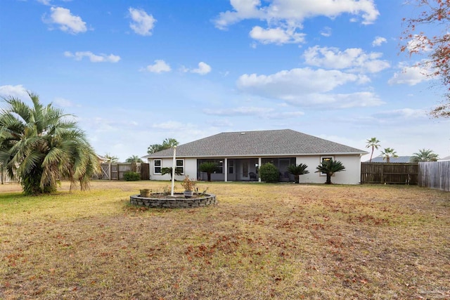 rear view of house with a yard