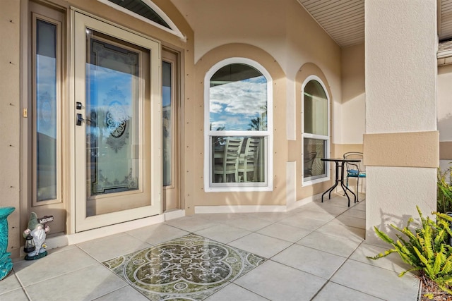 doorway to property with a patio