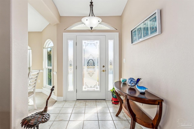 entryway with light tile patterned floors