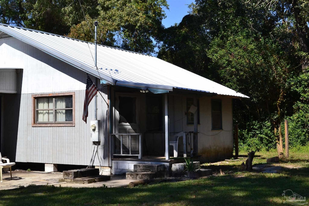 view of home's exterior with a yard