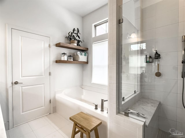 bathroom featuring separate shower and tub and tile patterned flooring