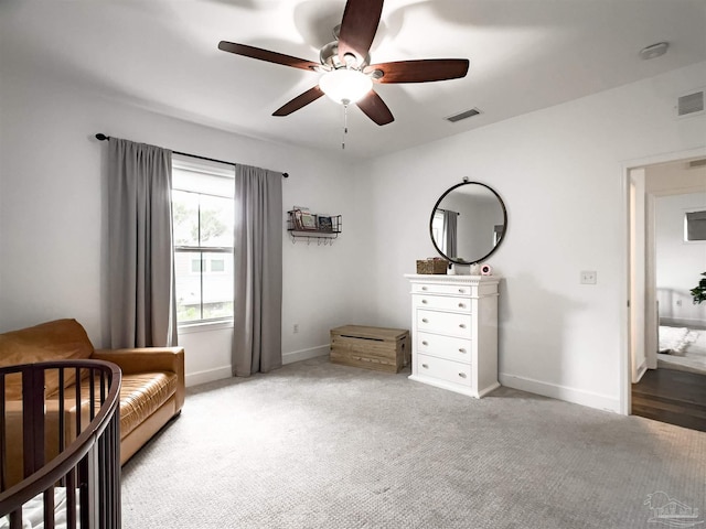 sitting room with light carpet and ceiling fan