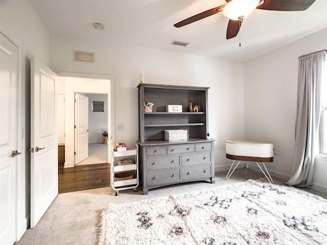 bedroom featuring ceiling fan and light carpet