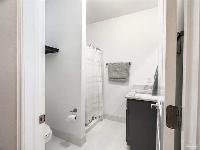 bathroom with vanity, a shower with curtain, and toilet