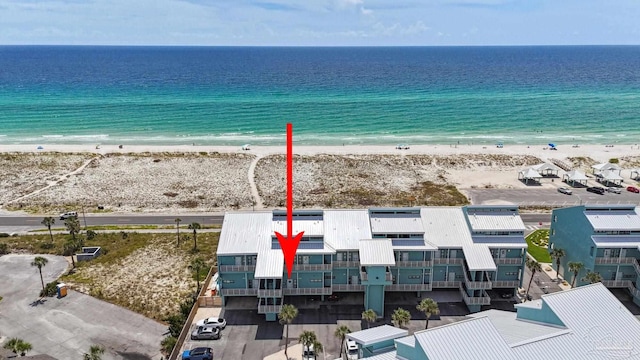 aerial view with a view of the beach and a water view