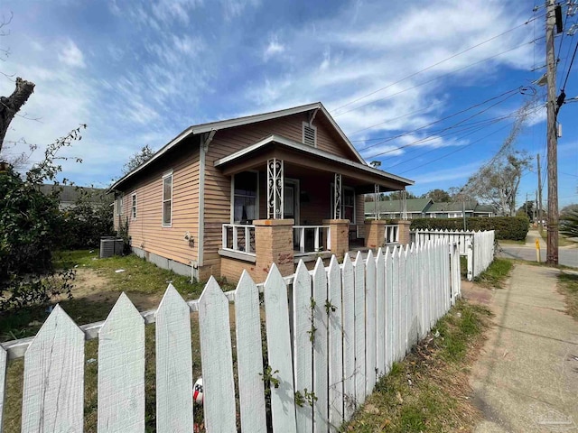 view of front facade with central air condition unit and covered porch