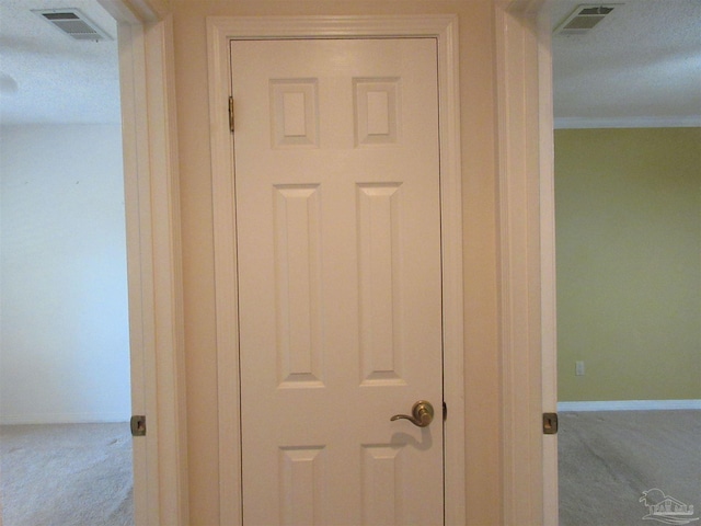 interior details with carpet floors and crown molding