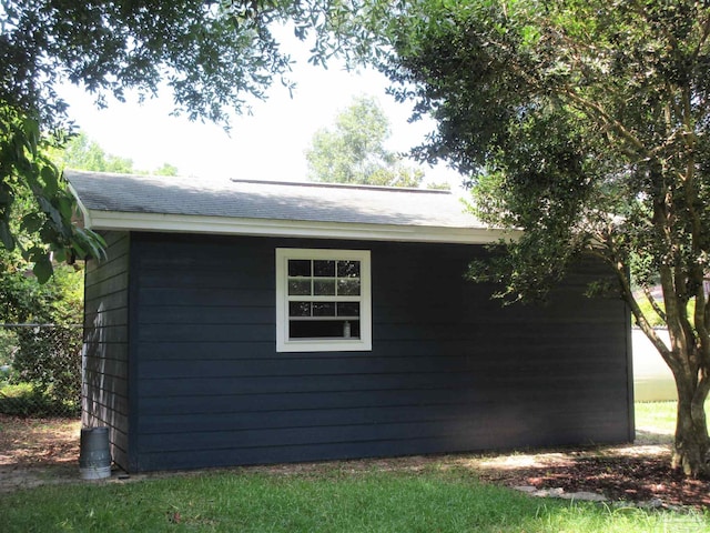 view of property exterior with an outbuilding