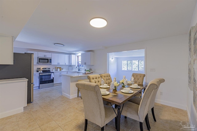 dining space featuring baseboards